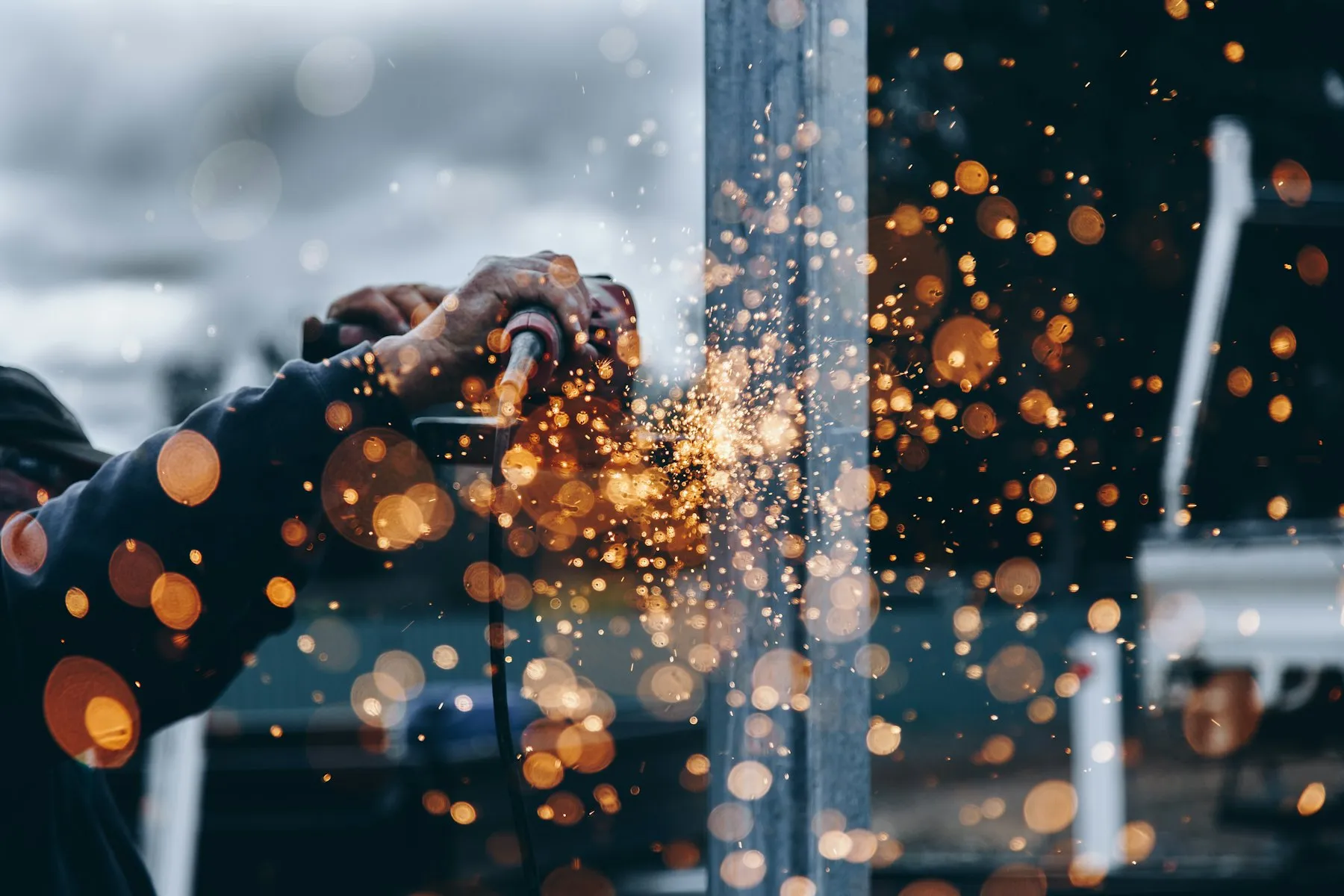 Sparks flying from a grinder cutting metal